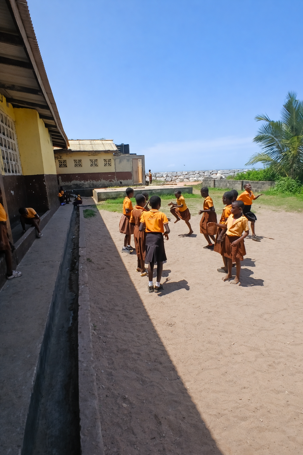 Children playing outside by schoolyard