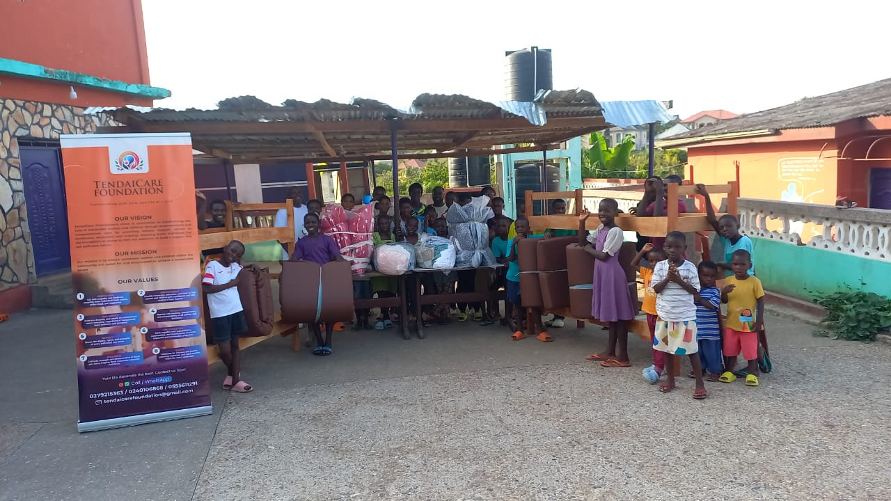 Children gathered with the new bunk beds and supplies