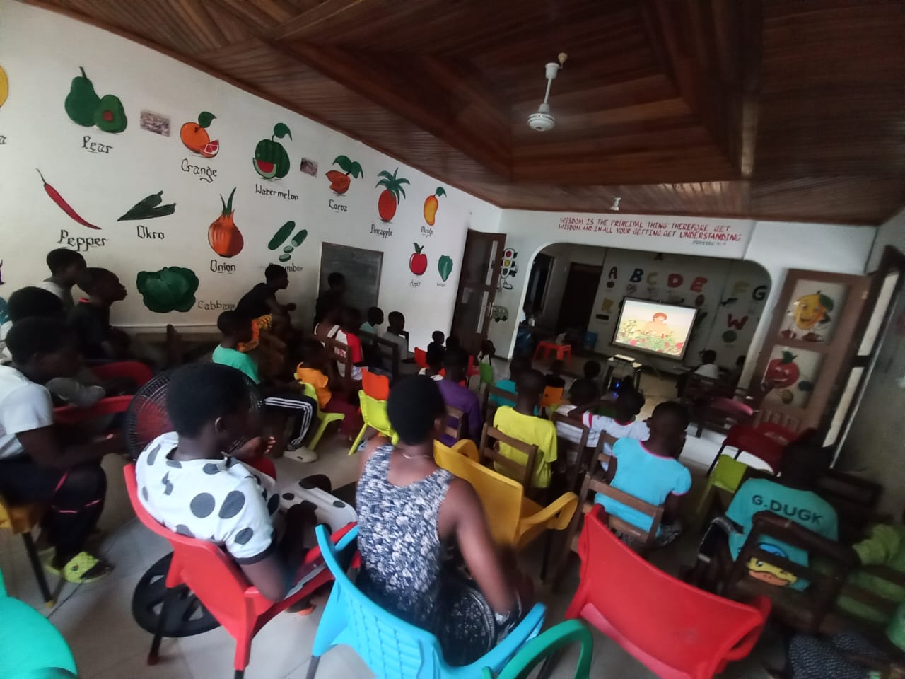 Volunteers and children working together
