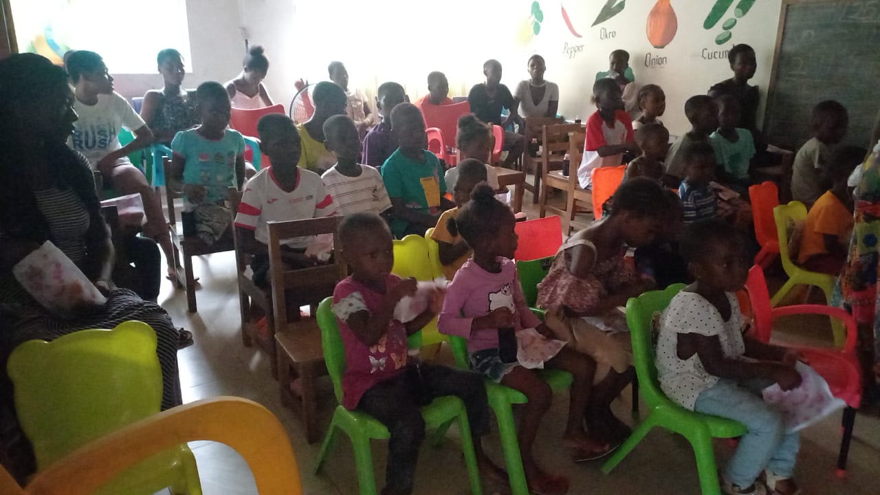 Team and children celebrating the completed beds