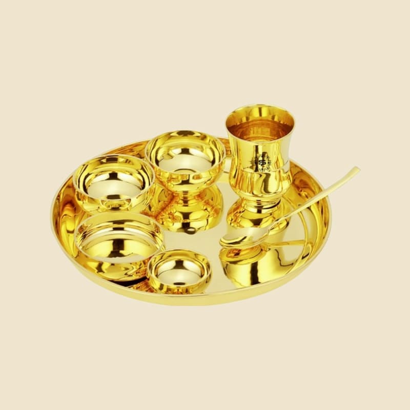 Brass Thali Set on a warm ivory background