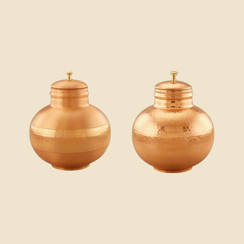 Hammered Copper Water Dispenser on a warm ivory background