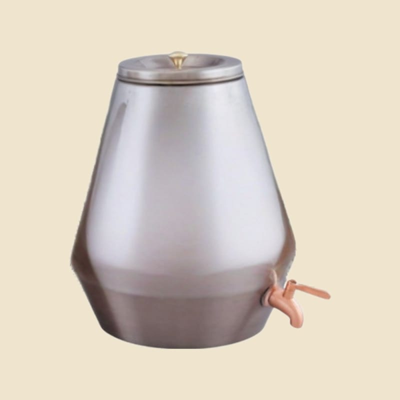 Royal Silver-Finish Copper Water Dispenser on a warm ivory background
