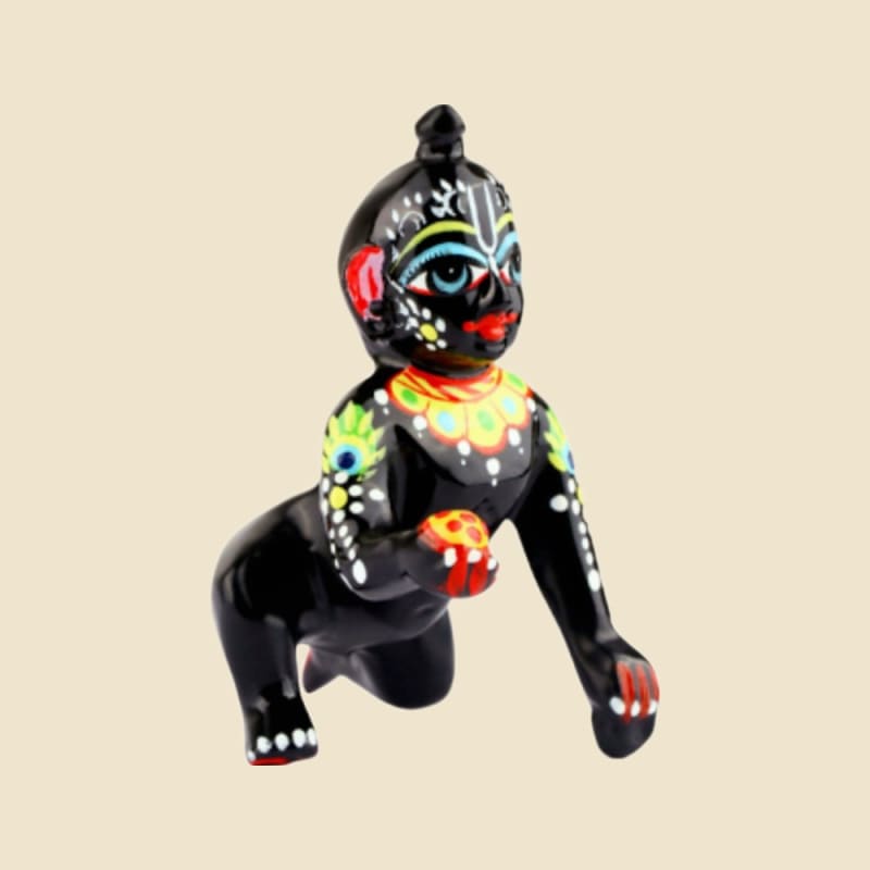 Black-painted Laddu Gopal with Colour Ornament Detailing on a warm ivory background