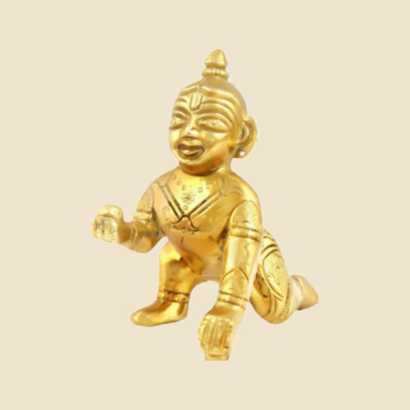 Brass Laddu Gopal, Smiling Face, Plain Finish on a warm ivory background