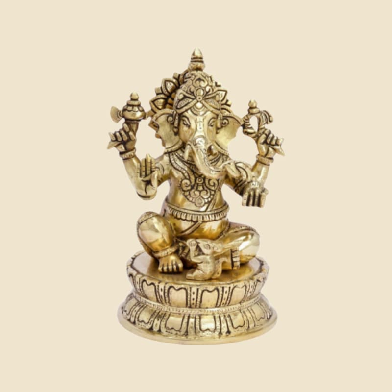 Brass Ganesha on Lotus Pedestal on a warm ivory background