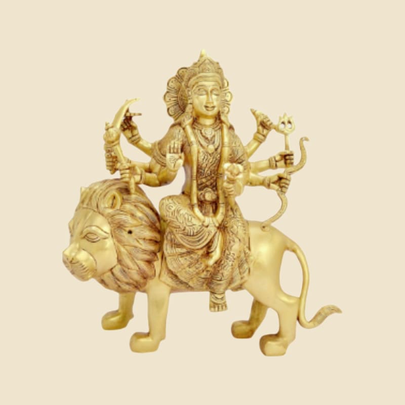 Brass Durga on Lion, no Base, Light Finish on a warm ivory background