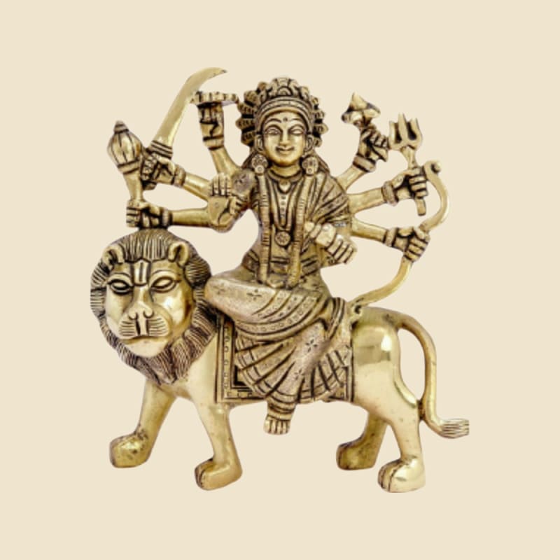Brass Durga on Lion with Sword on a warm ivory background