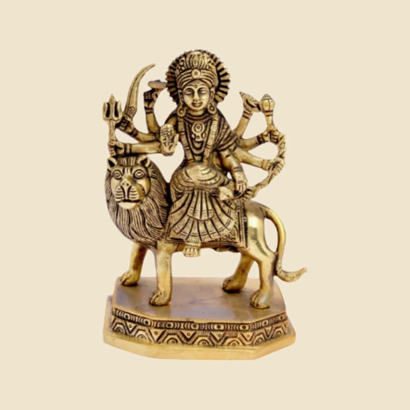 Brass Durga on Lion, Octagonal Base on a warm ivory background