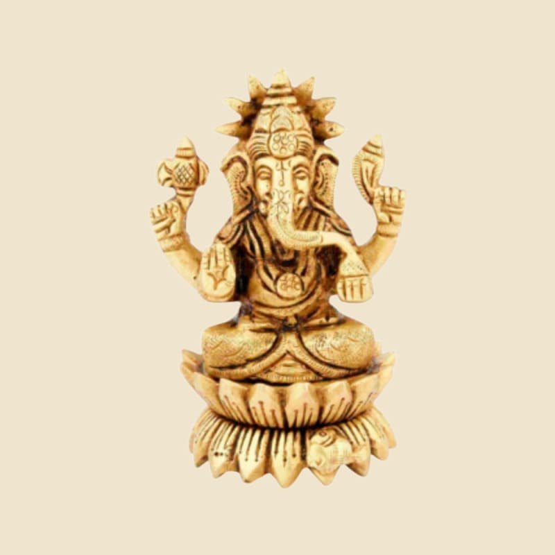 Brass Ganesha on Lotus Base on a warm ivory background