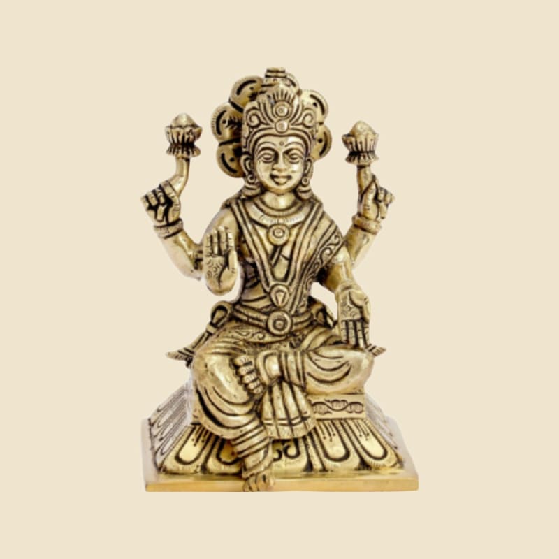 Brass Lakshmi on Square Base on a warm ivory background