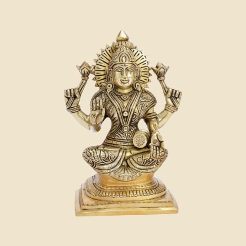 Brass Saraswati with Veena on Square Base on a warm ivory background
