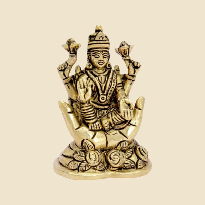 Brass Lakshmi on Lotus Flower Base on a warm ivory background