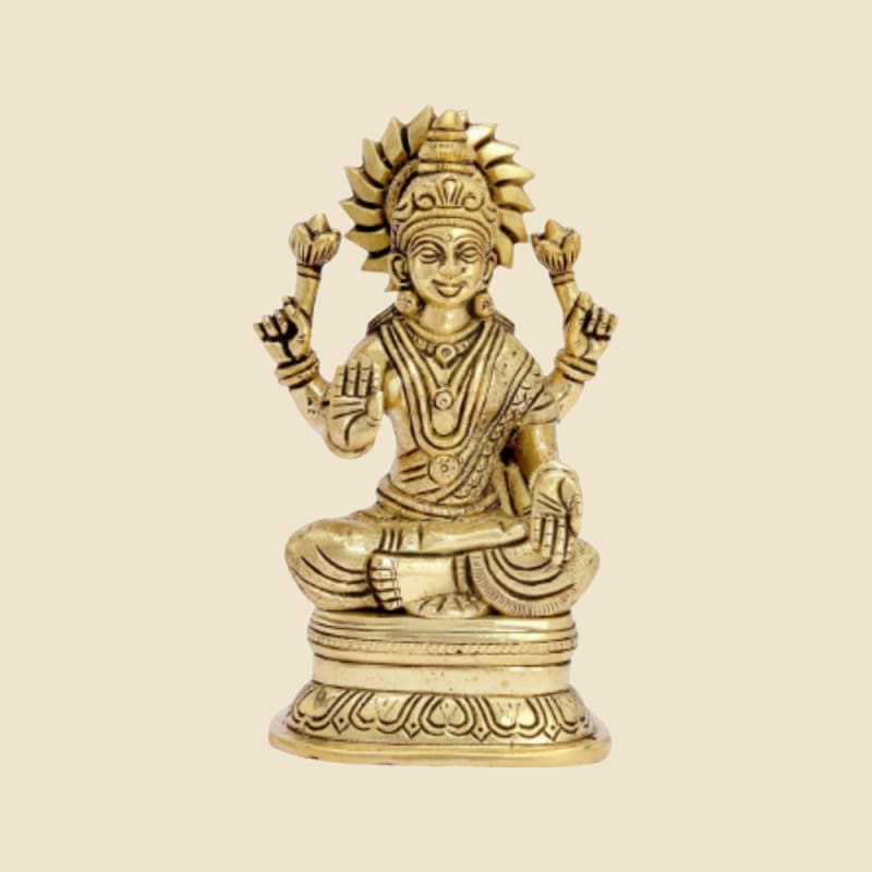 Brass Lakshmi on Round Base on a warm ivory background