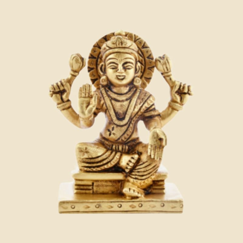 Brass Lakshmi on Rectangular Base on a warm ivory background