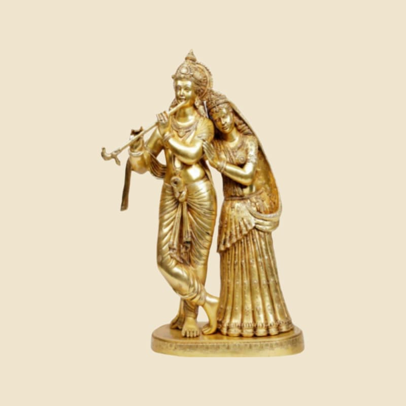 Brass Radha-Krishna Pair on a warm ivory background