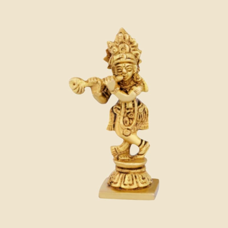 Brass Krishna Playing Flute, Dancing on a warm ivory background