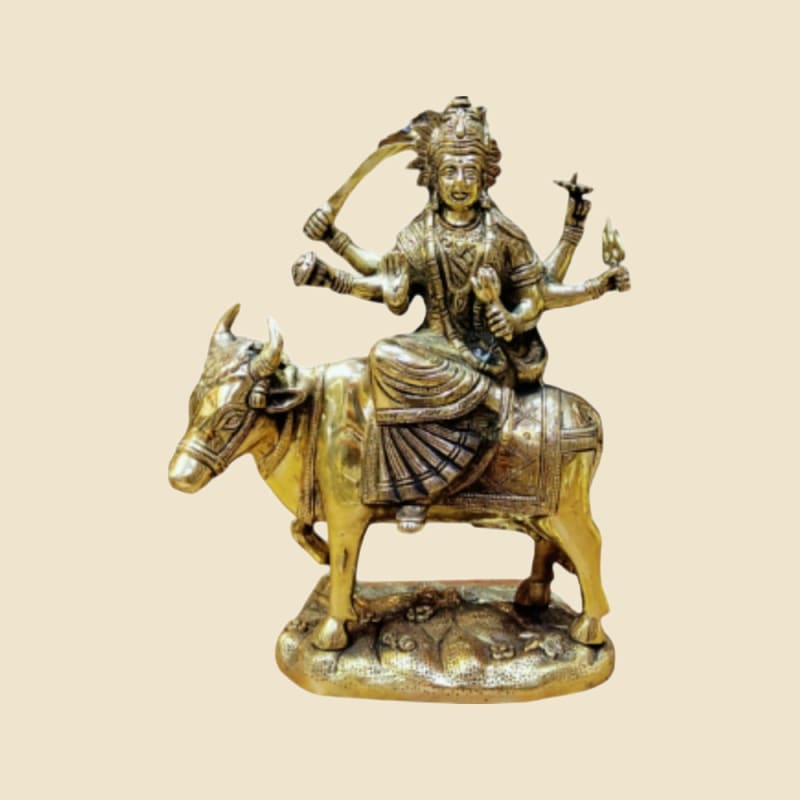 Brass Goddess on Bull on a warm ivory background