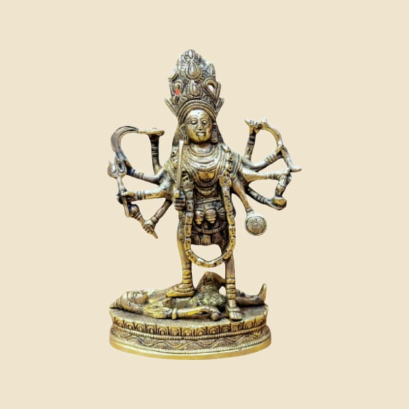 Brass Kali on a warm ivory background