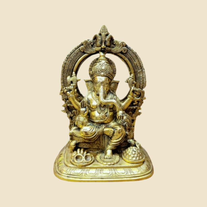 Brass Ganesha under Arch on a warm ivory background