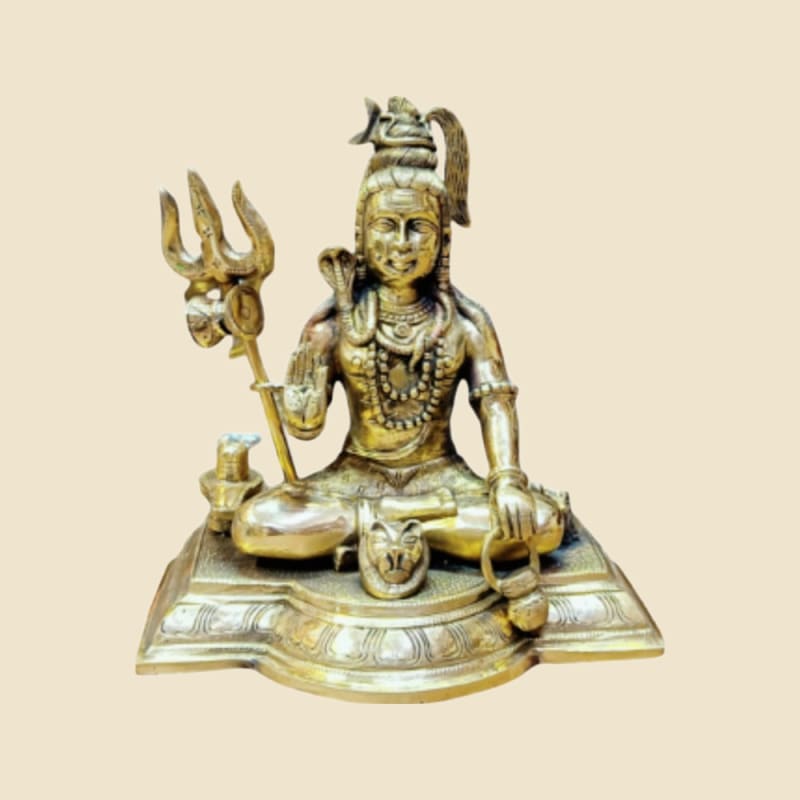 Brass Shiva Seated with Trishul on a warm ivory background