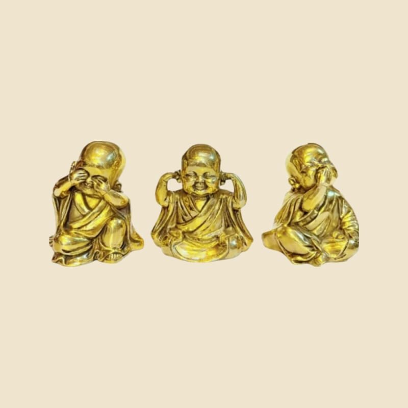 Brass Three Wise Monks Set on a warm ivory background