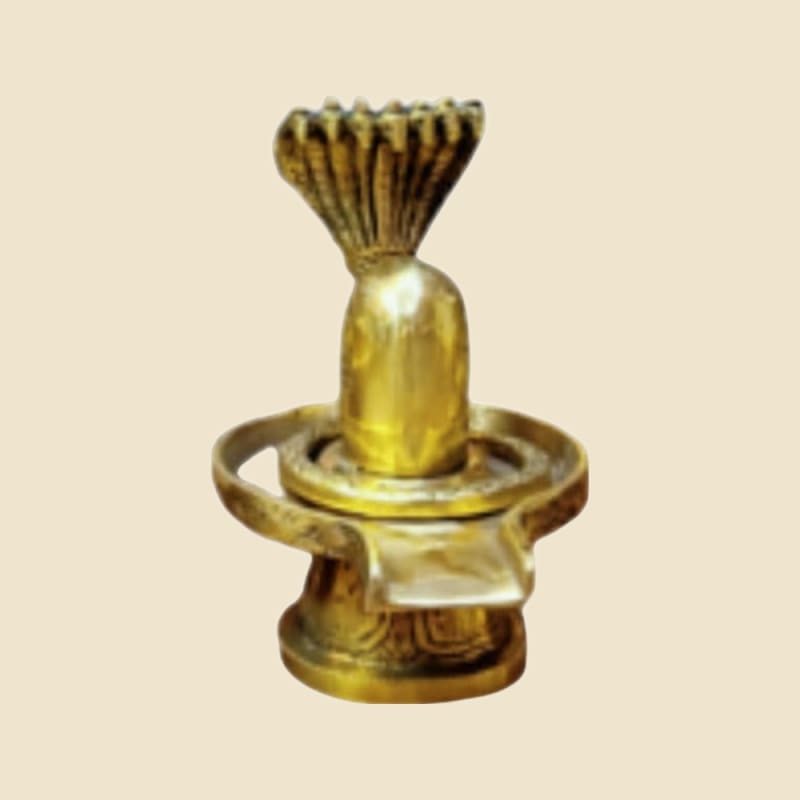 Small Brass Shivling on a warm ivory background
