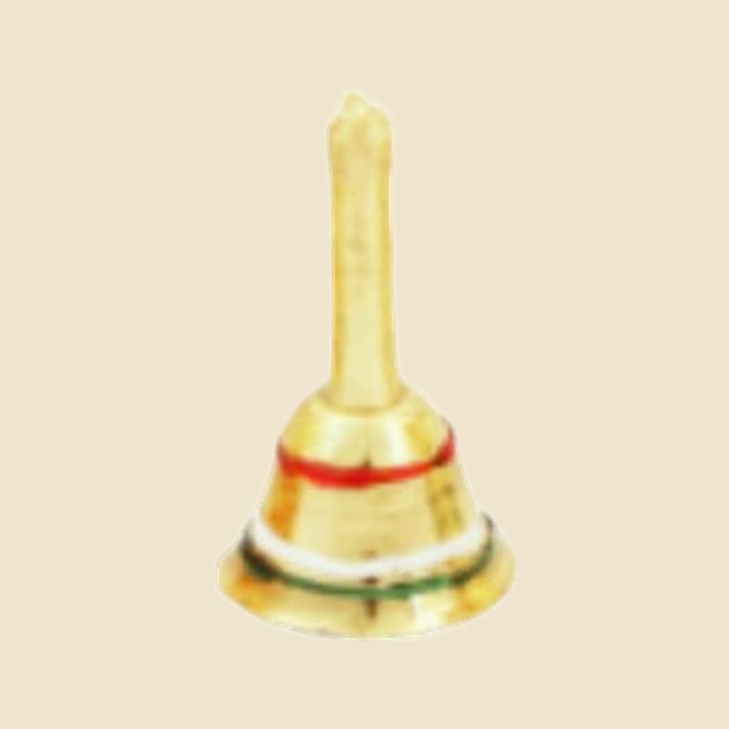 Brass Puja Bell on a warm ivory background