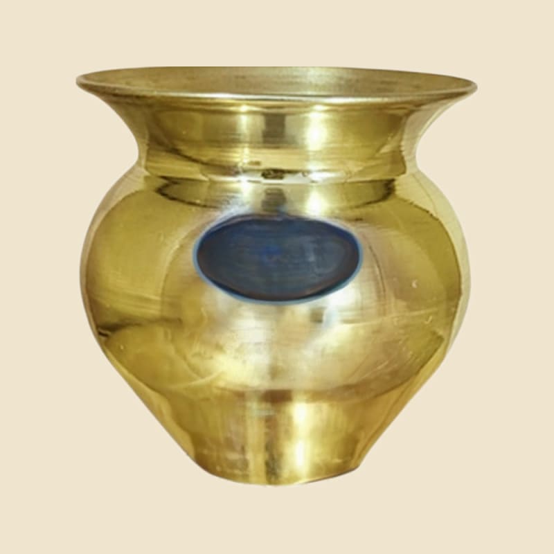 Brass Pooja Loti on a warm ivory background