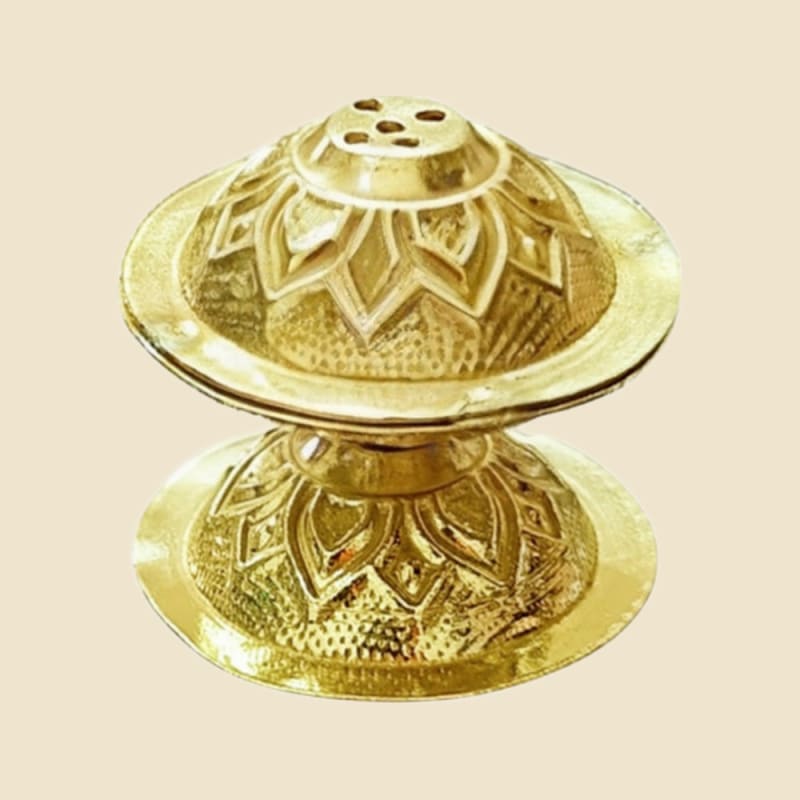 Brass Nakshi Agardan on a warm ivory background