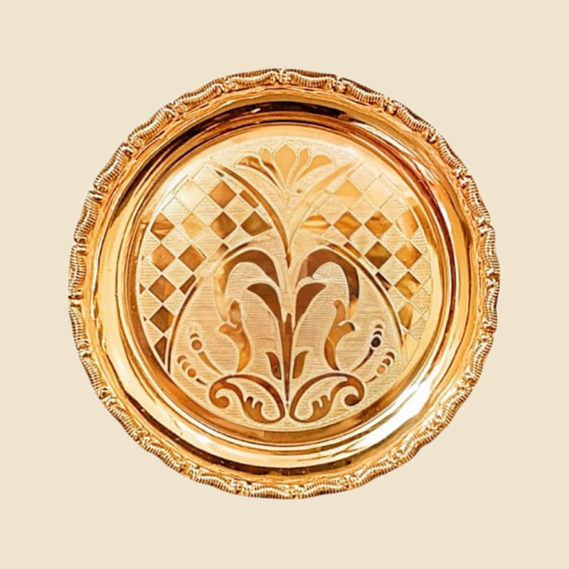 Brass Aruna Plate on a warm ivory background