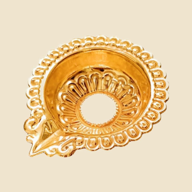 Copper Nakshi Chirag on a warm ivory background