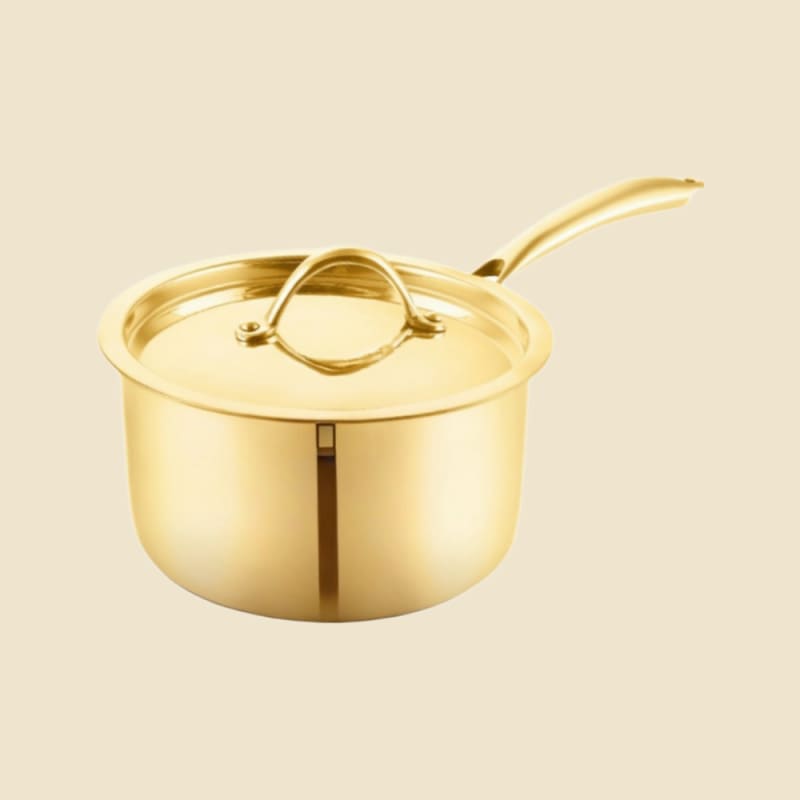 Brass Sauce Pan on a warm ivory background