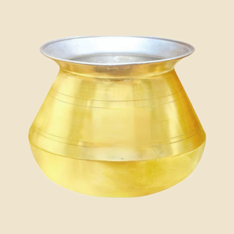 Brass Kalai Degchi on a warm ivory background