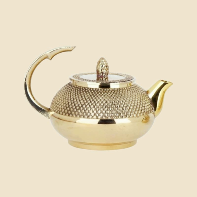 Brass Dana Kettle on a warm ivory background