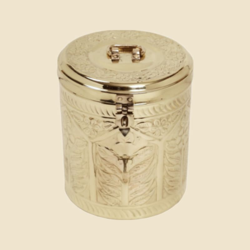 Brass Kundi Etched Dabba on a warm ivory background