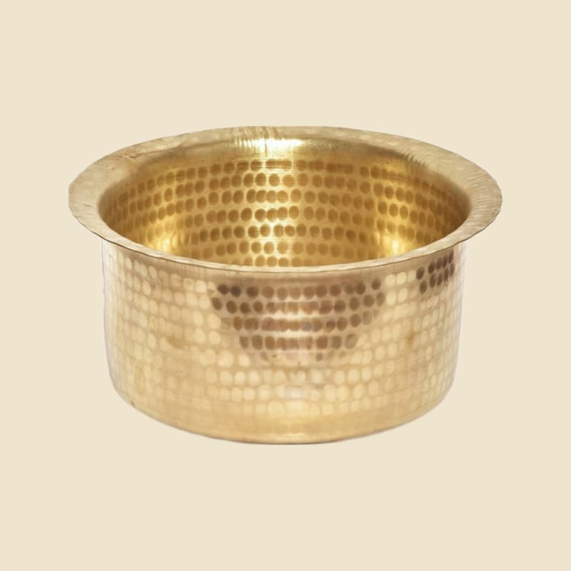 Brass Hammer Top Heavy on a warm ivory background