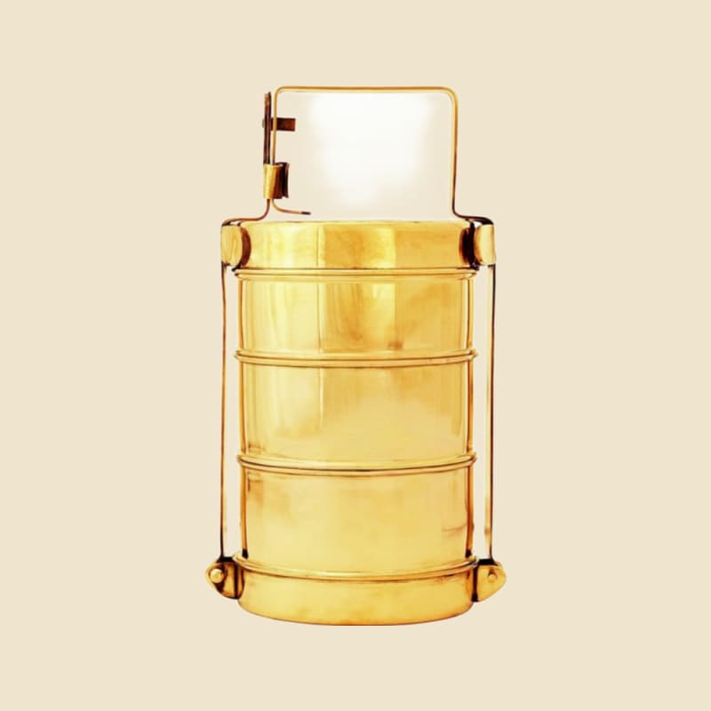 Brass Tiffin Regular on a warm ivory background