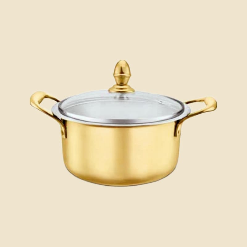 Brass Stock Pot on a warm ivory background