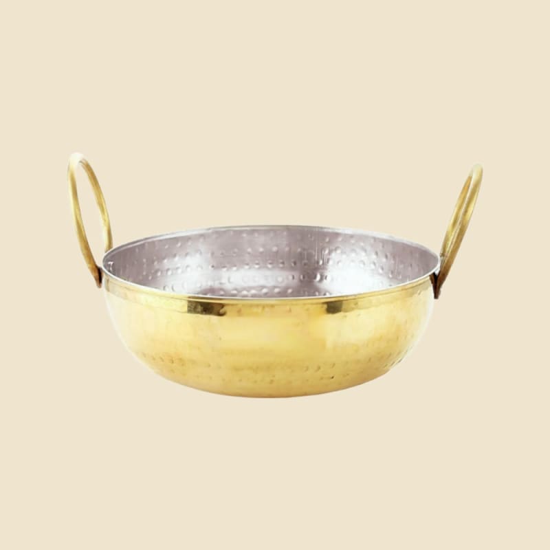Brass Kalai Hammered Kadhai on a warm ivory background