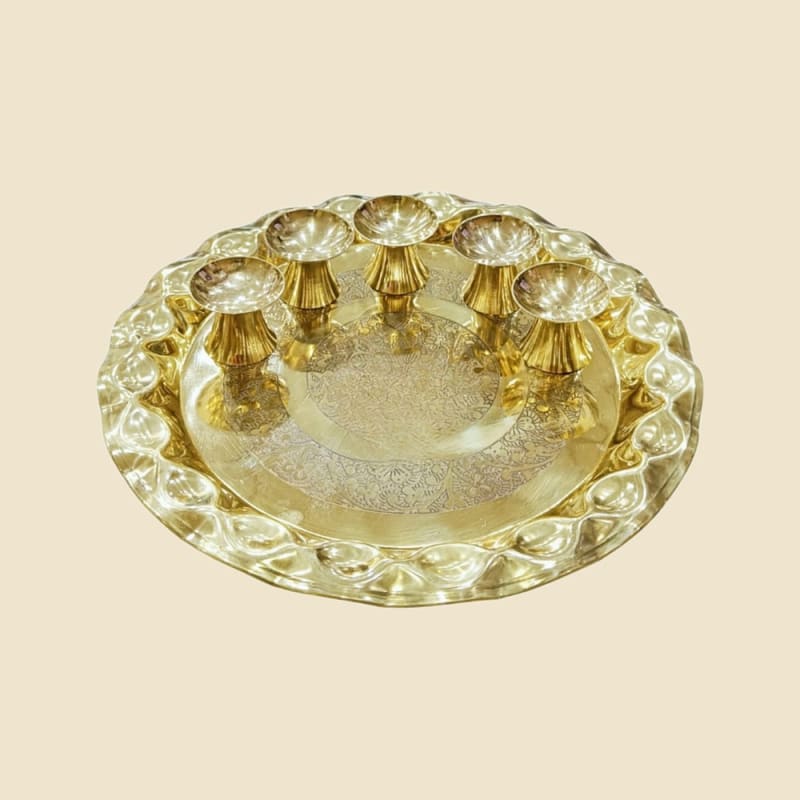 Brass Thali with Five Lotas on a warm ivory background