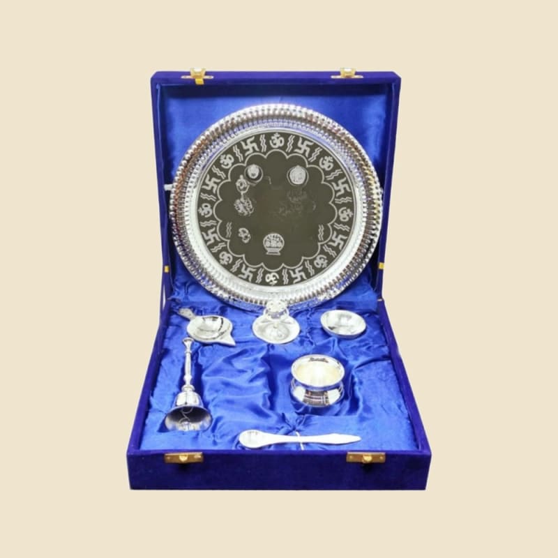 Om Swastik Silver Puja Gift Set in Blue Box on a warm ivory background