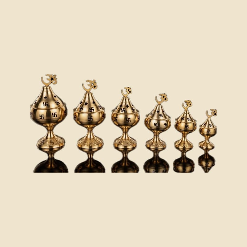 Ashok Metal Om Handi Diya, Set of 6 on a warm ivory background