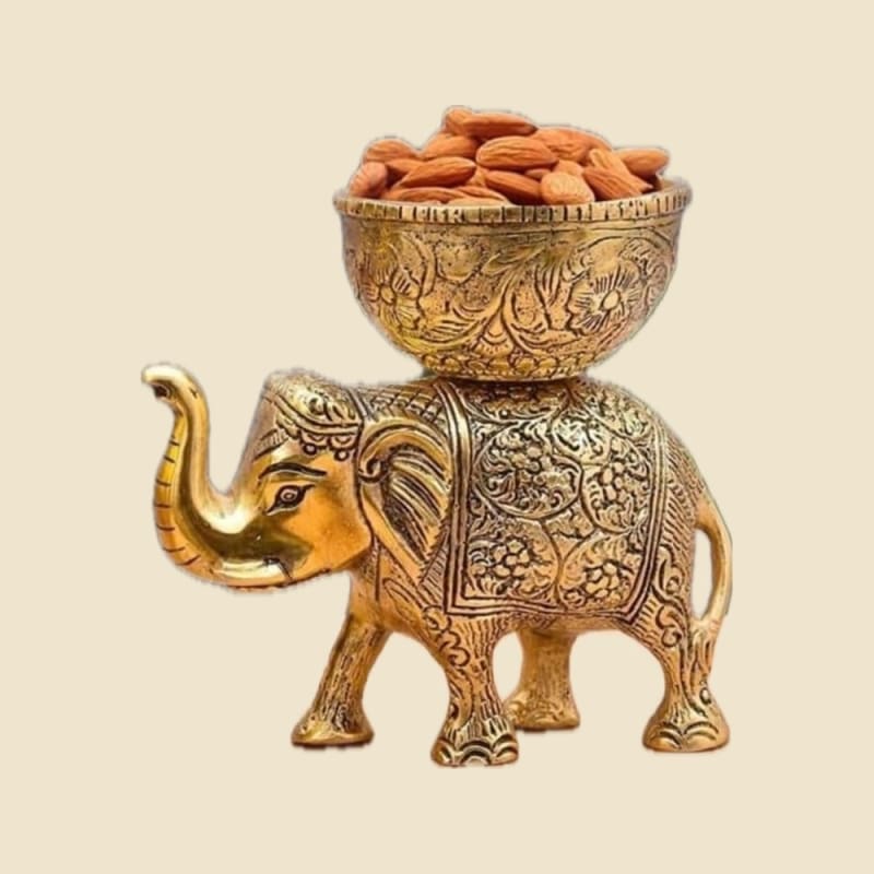 Elephant with Dry-Fruit Bowl on a warm ivory background