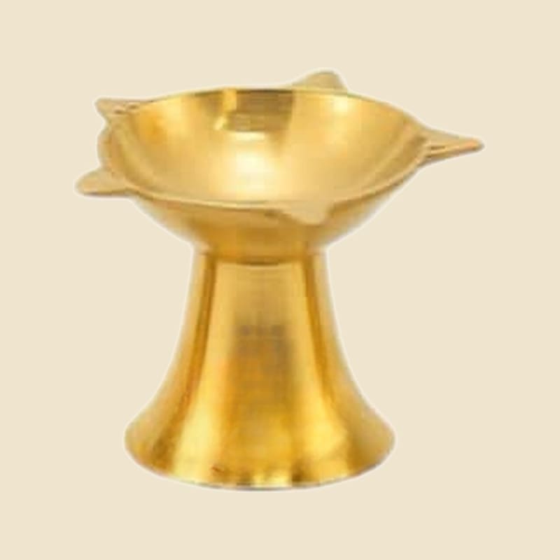 Star-Rim Brass Deepak, Large on a warm ivory background