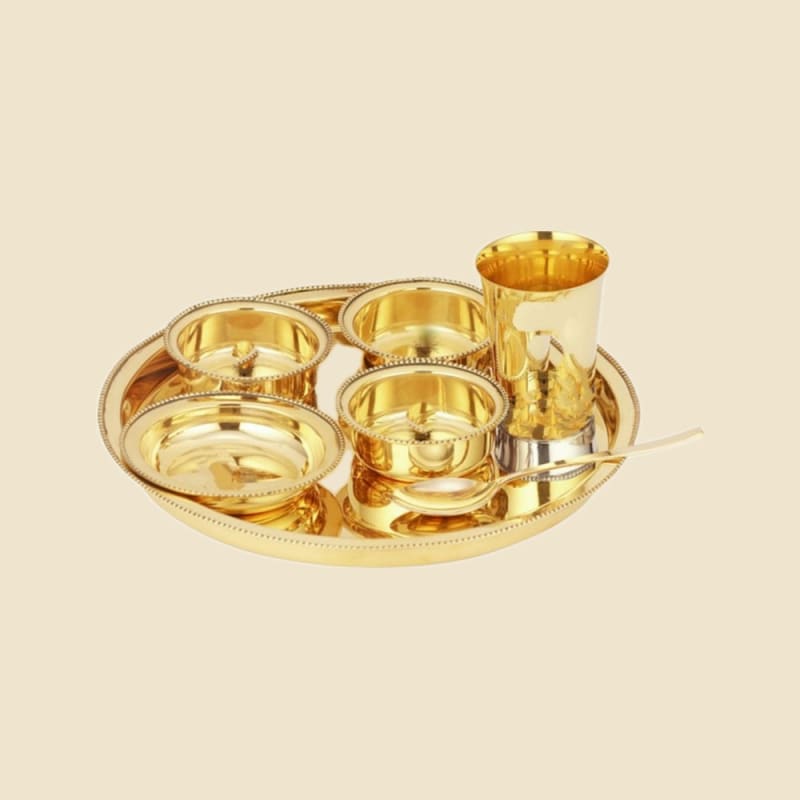 Brass Goldcraft Thali Set on a warm ivory background