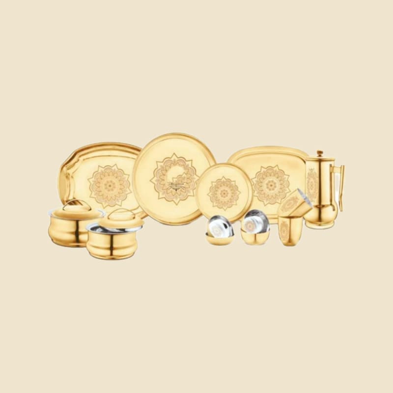Etched Brass Dinner Set on a warm ivory background