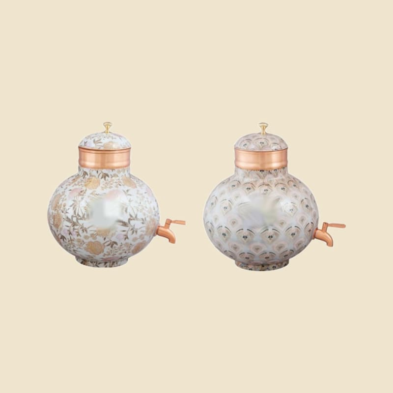 Meena Print Round Copper Water Dispenser on a warm ivory background