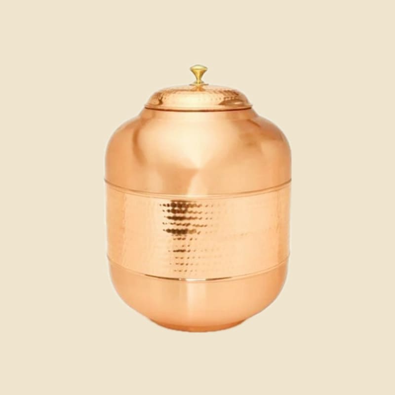 Half-Hammered Copper Water Dispenser on a warm ivory background