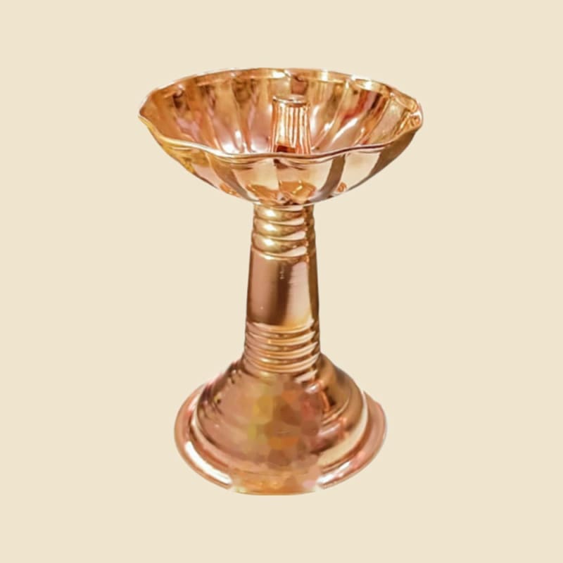Copper Samai Deepak on a warm ivory background